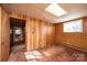 Simple bedroom with wood-paneled walls and carpet at 4745 16Th Street Ne Dr, Hickory, NC 28601