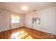 Spacious bedroom with hardwood floors and large windows at 4745 16Th Street Ne Dr, Hickory, NC 28601