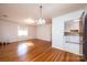 Hardwood floor dining room with kitchen and staircase access at 4745 16Th Street Ne Dr, Hickory, NC 28601