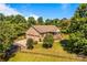 Aerial view of the brick home with a two car garage, and a large front yard at 795 French Belk Rd, Mt Ulla, NC 28125