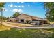 Wide shot of the barn's exterior with a large garage door and connected stables with ample space at 795 French Belk Rd, Mt Ulla, NC 28125