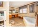 Spacious bathroom features a soaking tub, double vanity and separate storage cabinet at 795 French Belk Rd, Mt Ulla, NC 28125