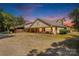 Exterior of a clubhouse featuring a rustic design with a porch and ample parking at 795 French Belk Rd, Mt Ulla, NC 28125