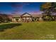 Charming brick home with a large front yard and welcoming covered porch at 795 French Belk Rd, Mt Ulla, NC 28125