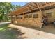 Covered horse stalls with wooden doors and convenient access for care and maintenance at 795 French Belk Rd, Mt Ulla, NC 28125
