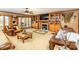 Cozy living room features a fireplace, custom built-ins and comfortable leather furniture at 795 French Belk Rd, Mt Ulla, NC 28125