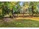 Well-maintained paddock with rustic wooden fence, offering a serene and secure space for horses at 795 French Belk Rd, Mt Ulla, NC 28125