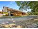 Outdoor stables with wooden stalls and ample room for horses and equipment, showing functionality and charm at 795 French Belk Rd, Mt Ulla, NC 28125
