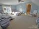 Bedroom with two beds, ceiling fan and large windows at 990 19Th Nw Ave, Hickory, NC 28601