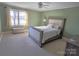 Bedroom with a queen bed, ceiling fan and large windows with a view at 990 19Th Nw Ave, Hickory, NC 28601