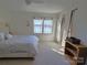 Bedroom with a queen bed, ceiling fan and large windows with curtains at 990 19Th Nw Ave, Hickory, NC 28601