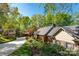 Beautiful home exterior with lush greenery, large driveway and a detached garage, offering ample space at 990 19Th Nw Ave, Hickory, NC 28601