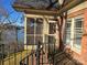 Exterior view of a home's porch with a screened in area and view of a body of water at 990 19Th Nw Ave, Hickory, NC 28601
