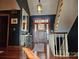 Inviting foyer with hardwood floors, staircase, stylish light fixture, and ample natural light from the front door at 990 19Th Nw Ave, Hickory, NC 28601
