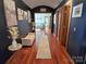 Hallway with hardwood floors, light-colored walls, arched doorway, and tasteful decor throughout the space at 990 19Th Nw Ave, Hickory, NC 28601