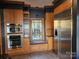 Bright kitchen featuring a stainless steel refrigerator and built in ovens at 990 19Th Nw Ave, Hickory, NC 28601