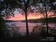 Stunning sunset view overlooking the tranquil lake, creating a peaceful and scenic backdrop at 990 19Th Nw Ave, Hickory, NC 28601