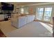 Bright living room featuring a large comfortable sofa, built-in shelves, and sliding glass doors offering scenic views at 990 19Th Nw Ave, Hickory, NC 28601