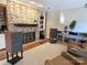 Inviting living room features a stone fireplace, stylish shelving, hardwood floors, and comfortable seating at 990 19Th Nw Ave, Hickory, NC 28601