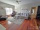 Bright living room features hardwood floors and comfortable seating at 990 19Th Nw Ave, Hickory, NC 28601