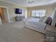 Large main bedroom with sitting area, large windows, TV and view at 990 19Th Nw Ave, Hickory, NC 28601