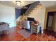 Well-lit office space with a desk, chair, and staircase access, perfect for working from home at 990 19Th Nw Ave, Hickory, NC 28601