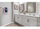 Double vanity bathroom with updated fixtures and tile flooring at 1024 20Th Avenue Se Way, Hickory, NC 28602