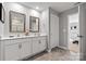 Double vanity bathroom with a large mirror and tiled floor at 1024 20Th Avenue Se Way, Hickory, NC 28602