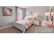 Bedroom with a full-size bed, pink decor, and a white dresser at 1024 20Th Avenue Se Way, Hickory, NC 28602