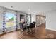 Dining area with hardwood floors, large windows, and a four-person table at 1024 20Th Avenue Se Way, Hickory, NC 28602