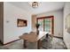 Bright dining room with table and chairs, access to deck at 1061 Woodlake Ln, Tega Cay, SC 29708