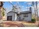 Gray house with dark brown garage door and steps leading to the front entrance at 1061 Woodlake Ln, Tega Cay, SC 29708