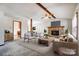 Living room features a stone fireplace and vaulted ceiling at 1061 Woodlake Ln, Tega Cay, SC 29708