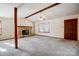 Living room with a stone fireplace and wood beam at 1061 Woodlake Ln, Tega Cay, SC 29708