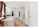 Large bathroom with double vanity, soaking tub, and shower at 112 Artisan Ct, Mooresville, NC 28117