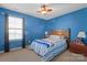 Blue bedroom with a full-size bed and a chest at 112 Artisan Ct, Mooresville, NC 28117