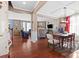 Open dining area with hardwood floors and access to living room at 112 Artisan Ct, Mooresville, NC 28117