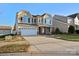 Two-story house with a large front yard, two-car garage, and neutral-colored siding at 112 Artisan Ct, Mooresville, NC 28117