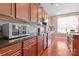 Modern kitchen with stainless steel appliances and granite countertops at 112 Artisan Ct, Mooresville, NC 28117