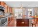 Eat-in kitchen with granite countertops, stainless steel appliances, and an island at 112 Artisan Ct, Mooresville, NC 28117
