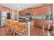 Modern kitchen with granite countertops, stainless steel appliances, and wood cabinets at 112 Artisan Ct, Mooresville, NC 28117
