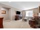 Cozy living room featuring comfortable seating and a large TV at 112 Artisan Ct, Mooresville, NC 28117