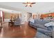 Open living room with hardwood floors, comfortable seating, and views into the kitchen at 112 Artisan Ct, Mooresville, NC 28117