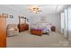 Bright main bedroom with ceiling fan and ample closet space at 112 Artisan Ct, Mooresville, NC 28117
