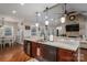 Kitchen with island, granite countertops, and hardwood floors at 1370 Null Rd, Lincolnton, NC 28092