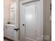 Bright laundry room with a sink and white cabinets at 1370 Null Rd, Lincolnton, NC 28092