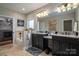 Bathroom with soaking tub, walk-in shower, and vanity with dual sinks at 1370 Null Rd, Lincolnton, NC 28092