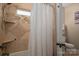 Modern bathroom with a tile shower featuring a shower niche, and a clear glass window at 1370 Null Rd, Lincolnton, NC 28092