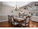 Formal dining room showcases hardwood floors, elegant lighting, and seating for eight at 1370 Null Rd, Lincolnton, NC 28092