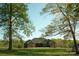 Beautiful brick home with a well-maintained lawn, mature trees and covered porch at 1370 Null Rd, Lincolnton, NC 28092